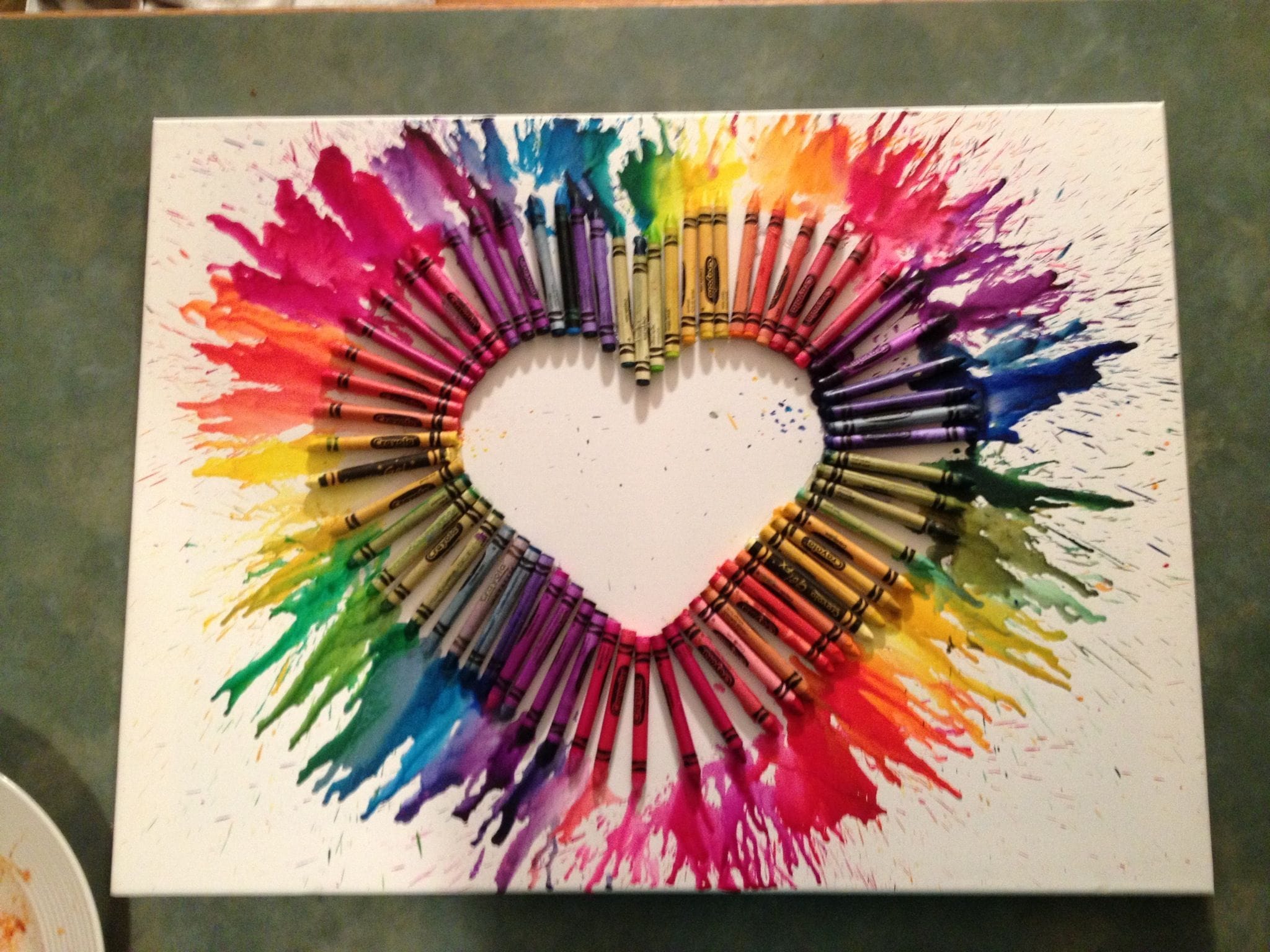 A child creating a collage with colored cellophane sheets